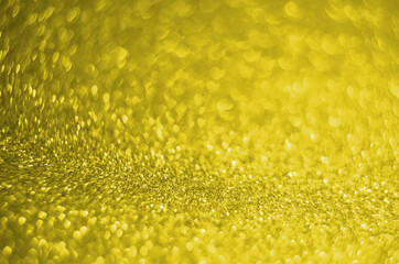 Illuminating Pantone Color Of The Year 2021. Abstract festive bokeh background with shining defocus sparkles. Blurred glitters shimmering dust macro close up, copy space for text logo