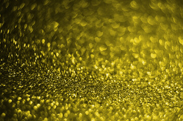 Illuminating Pantone Color Of The Year 2021. Abstract festive bokeh background with shining defocus sparkles. Blurred glitters shimmering dust macro close up, copy space for text logo