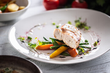 Dietary chicken cooked with healthy vegetavles and served with green pesto