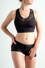 Female activewear. Outfit for branding. Workout design clothes. Slim woman body in blank label...