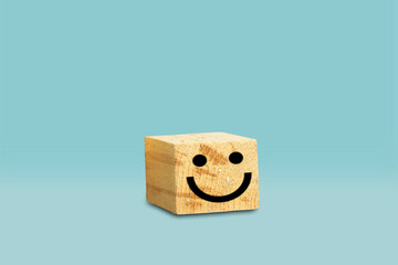 Customer service evaluation and satisfaction survey concepts. positive face on wood big cube