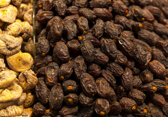 Bunch of dried dates and dried figs on street market