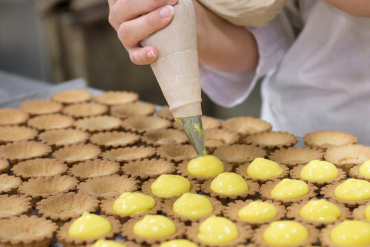 Professional production of pastries in bakery laboratory
