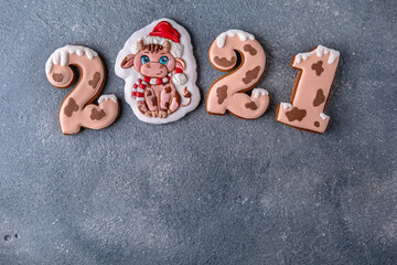 Happy New Year's set of numbers 2021. Ox-shaped cookies, symbol of the Chinese horoscope. Christmas homemade gingerbread cookies.