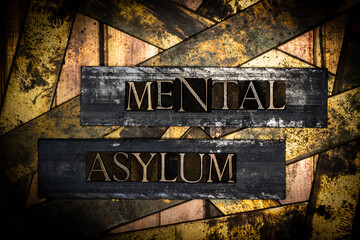 Mental Asylum text on vintage textured bronze grunge copper and gold background