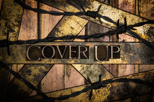 Cover Up text on vintage textured bronze grunge copper and gold background
