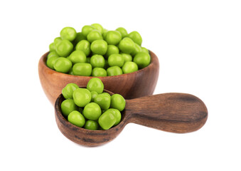 Canned green peas in wooden bowl and spoon, isolated on white background. Pickled green peas.