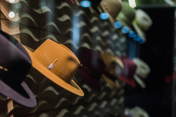 Elegant hats in a store - shopping concept