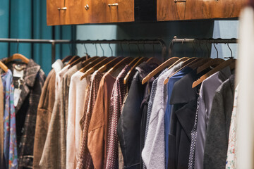 men clothing on hanger in a shop - shopping in mall concept