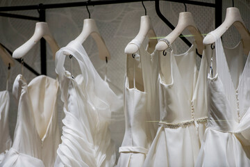 White wedding dresses in a store - shopping concept