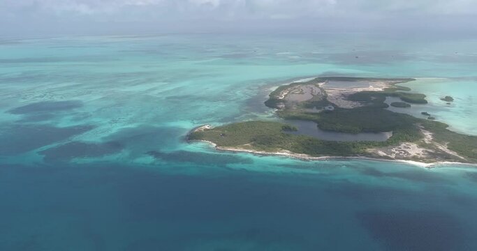 Los Roques Venezuela  drone aerial view  pan rigth Tropical Island rabusky  turquoise waters.
