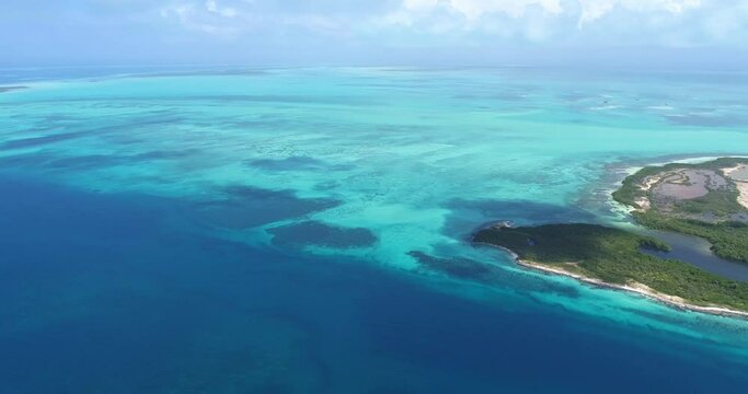 Los Roques Venezuela  drone aerial view  pan rigth Tropical Island rabusky  turquoise waters.
