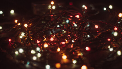 Christmas garland in retro style. Garland, lights, dark background, retro.