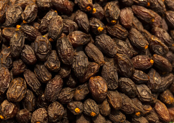 Dried dates on street market,background