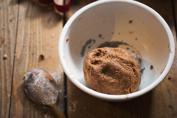 Ball of gingerbread dough with flour