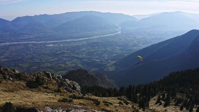 paragliding from Mount Pizzocco to dolomites valley, adventure sport aerial