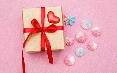 Box with bow and sweets. Lollipop heart. Flat layout.