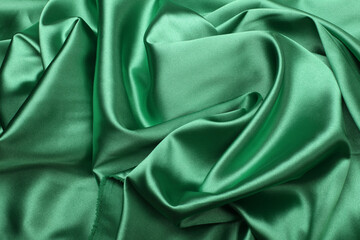 Green wave silk fabric horizontal background.