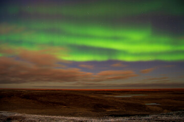 aurora borealis above the clouds