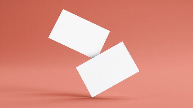 Two floating business cards mockup on a pink background. Insert your design. Branding concept