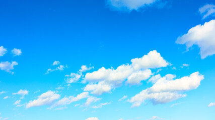 Naklejka na ściany i meble Panoramic view of blue sky with white clouds
