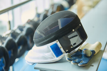 Masks for fencing, uniforms for competition. An active Olympic sport.