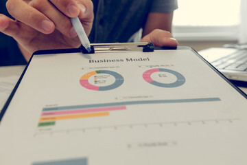 Close up of a business man working with diagrams.