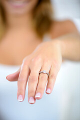 a lady showing engagement ring