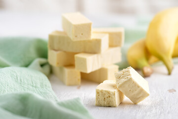 sweet confectionery Pastila with Banana puree a on bright table.