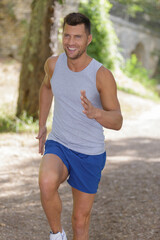 man running jogging outdoors in park