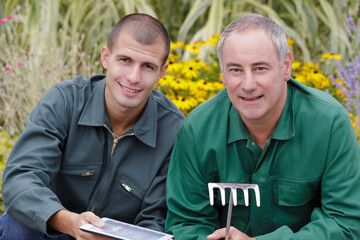 portrait of two happy gardeners