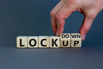 Lockdown or lockup symbol. Hand turns cubes and changes the word 'lockup' to 'lockdown'. Beautiful...