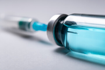 Closeup of glass bottle with coronavirus medication