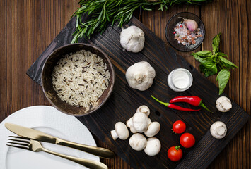 Fresh vegetables and rice in plate, top view