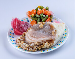 Ingredients in a frozen state of a turkey TV dinner