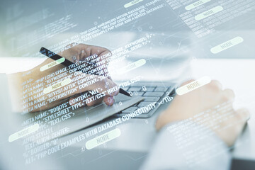 Double exposure of abstract creative programming illustration and hand writing in notepad on background with laptop, big data and blockchain concept