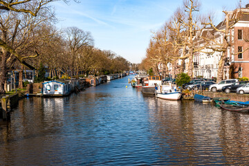 Fototapeta na wymiar House boats in an Amsterdam canal editorial stock picture