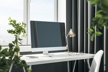 Stylish designer desktop with empty computer screen
