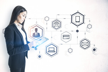 Young businesswoman using tablet computer and drawing computer cloud diagram