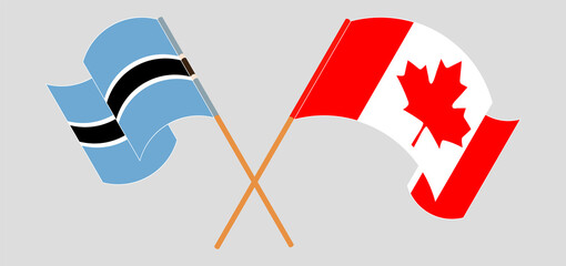 Crossed and waving flags of Botswana and Canada