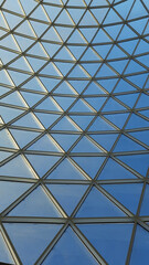 Glass dome of the building. Glass frame in the ceiling. Modern architecture.