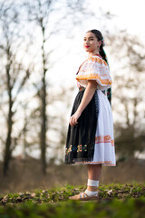 Young beautiful slovak woman in traditional dress. Slovak folklore