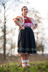 Young beautiful slovak woman in traditional dress. Slovak folklore