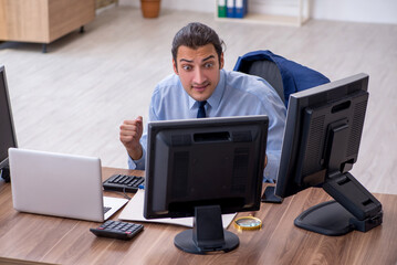 Young male employee working in the office