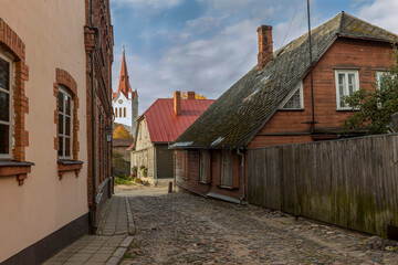 Empty cobblestone streets and church tower in the small town of Cesis, Latvia