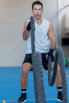 Battle rope exercise in the gym 