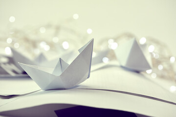 paper boats on the documents