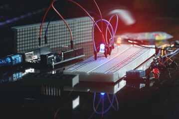 Man learns the basics of programming microprocessors close up.