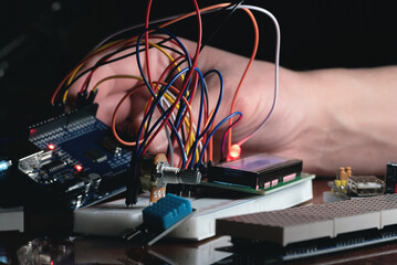 Man learns the basics of programming microprocessors close up.