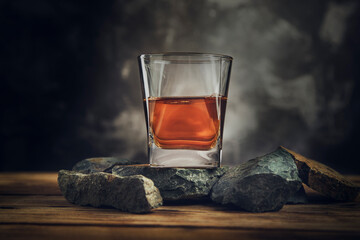 glass of whiskey on stone
